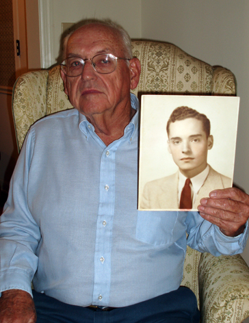 Younger brother Everett holding a picture of missing elder brother Ernest Garner, who went missing in the CBI during WWII in 1945. (Photo taken 2008.)