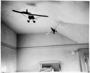 Models hanging from the ceiling of Robert Fensler\'s bedroom in the 1930s.
