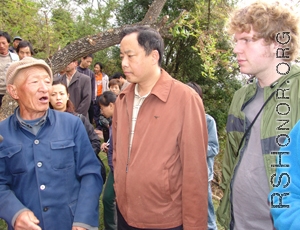 Figure 7: Eyewitness Mr. Song recounts what he had seen sixty-plus years before. Center is the very kind Mr. WANG Jing, on the right, student Andy listens.