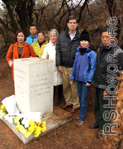Judy, Larry, and members of the Li family at the marker site. 