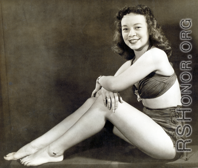 Harold Dixon's wife Sue Emens Dixon in a WWII era pin-up pose. Shot by the "Hobbs & Looney Studio" in Decatur, Alabama, the notation "Please rush - must have before Friday" amd a request for three copies is written in pencil on the back, causing one to wonder if one copy was for a husband going on deployment.