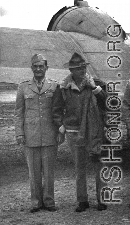 Chennault and Stilwell pose together in front of wing of transport airplane in Yunnan, China, during WWII.