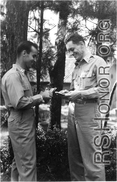 GIs count cash among pines at Yangkai air base during WWII.