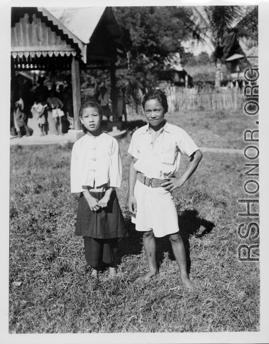 Kachin boy and girl in Burma.  Near the 797th Engineer Forestry Company.  During WWII.