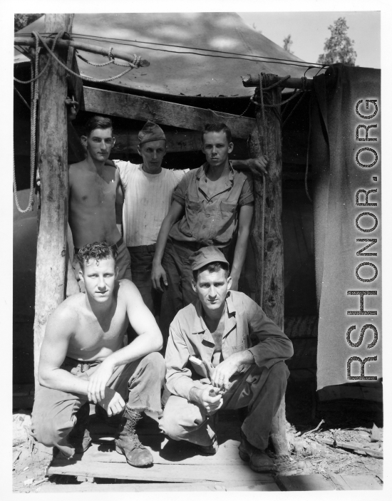 Engineers of the 797th Engineer Forestry Company pose in their tent in Burma.  During WWII.
