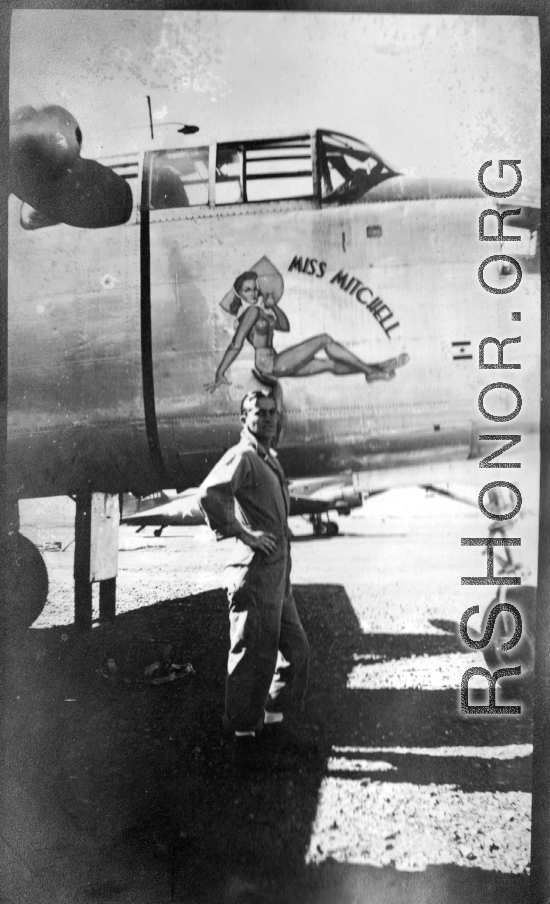 Flyer standing with B-25 "MISS MITCHELL," in CBI during WWII.