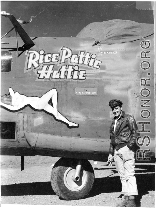 Flyer standing with F-7A "Rice Pattie Hattie." 24th Combat Mapping Squadron, 8th Photo Reconnaissance Group, 10th Air Force
