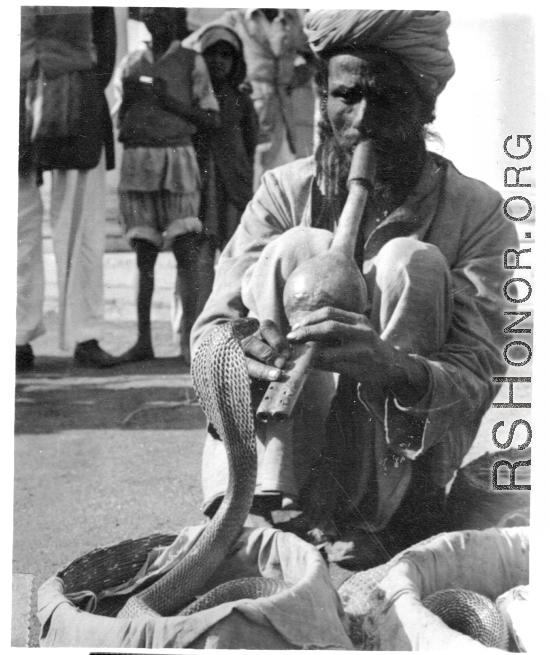 Snake charmer in India, during WWII.