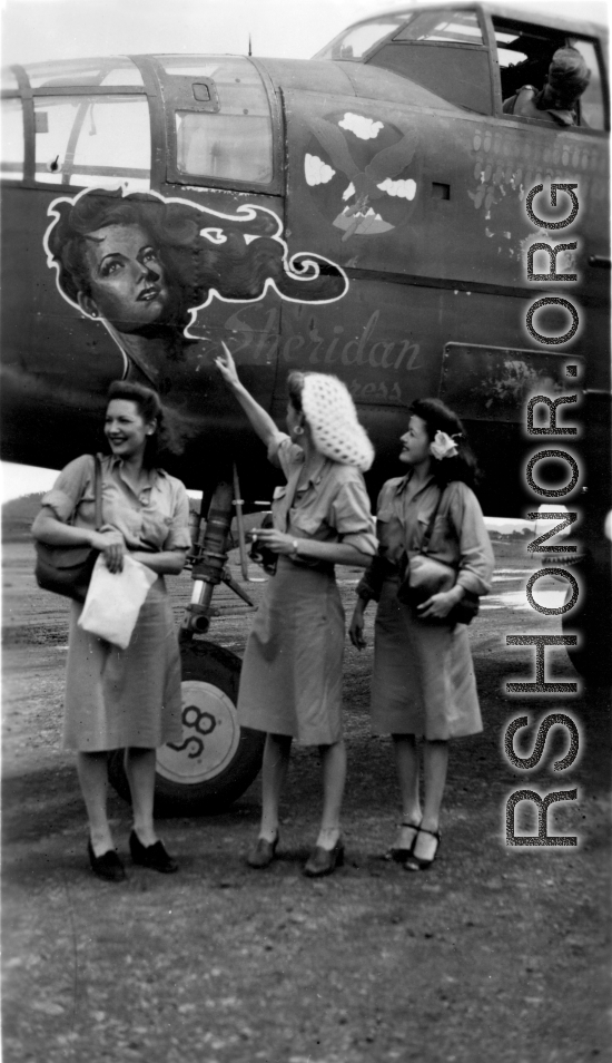 Celebrities visit and perform at Yangkai, Yunnan province, during WWII: Mary Landa, Ann Sheridan, Ruth Dennis pose with B-25 with Sheridan's image as nose art.