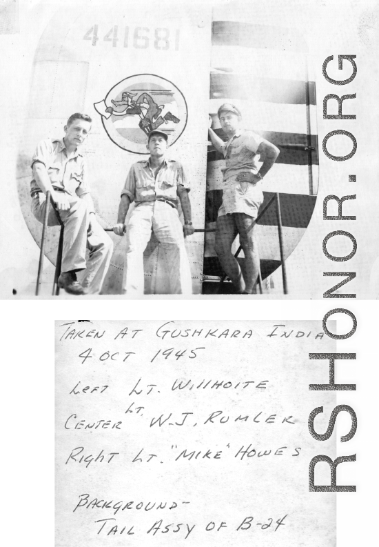 American flyers with tail assembly of a F-7A/B-24, showing The Wily Wolves insignia. October 4, 1945, Gushkara, India.  Lt. Willhoite, Lt. W. J. Rumler, Lt. "Mike" Howes.  24th Combat Mapping Squadron, 8th Photo Reconnaissance Group, 10th Air Force.