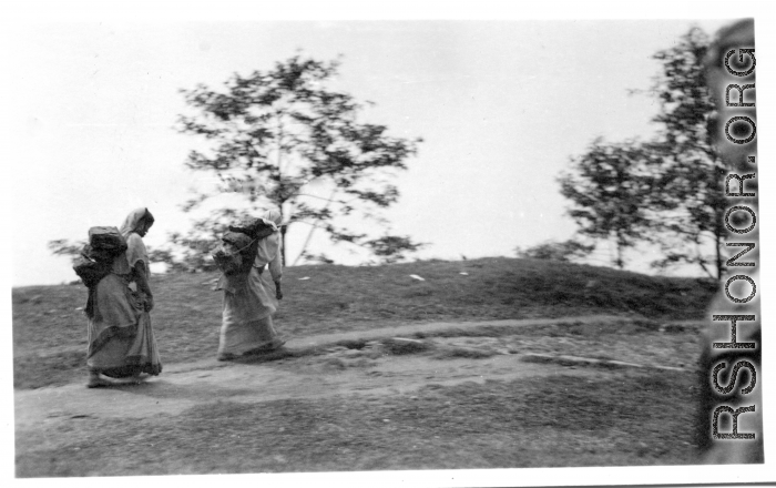 Women carry packs at Darjeeling, India, during WWII.