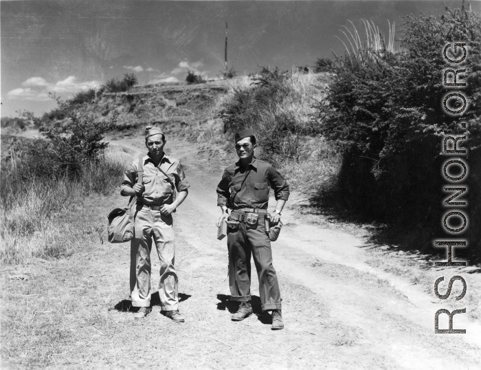 Photographer Eugene Wozniak and a language interpreter take a stroll about in Yunnan, China, during WWII.