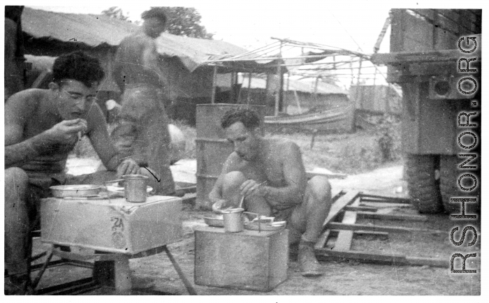 GIs getting chow while on the road or at a camp. During WWII in the CBI.
