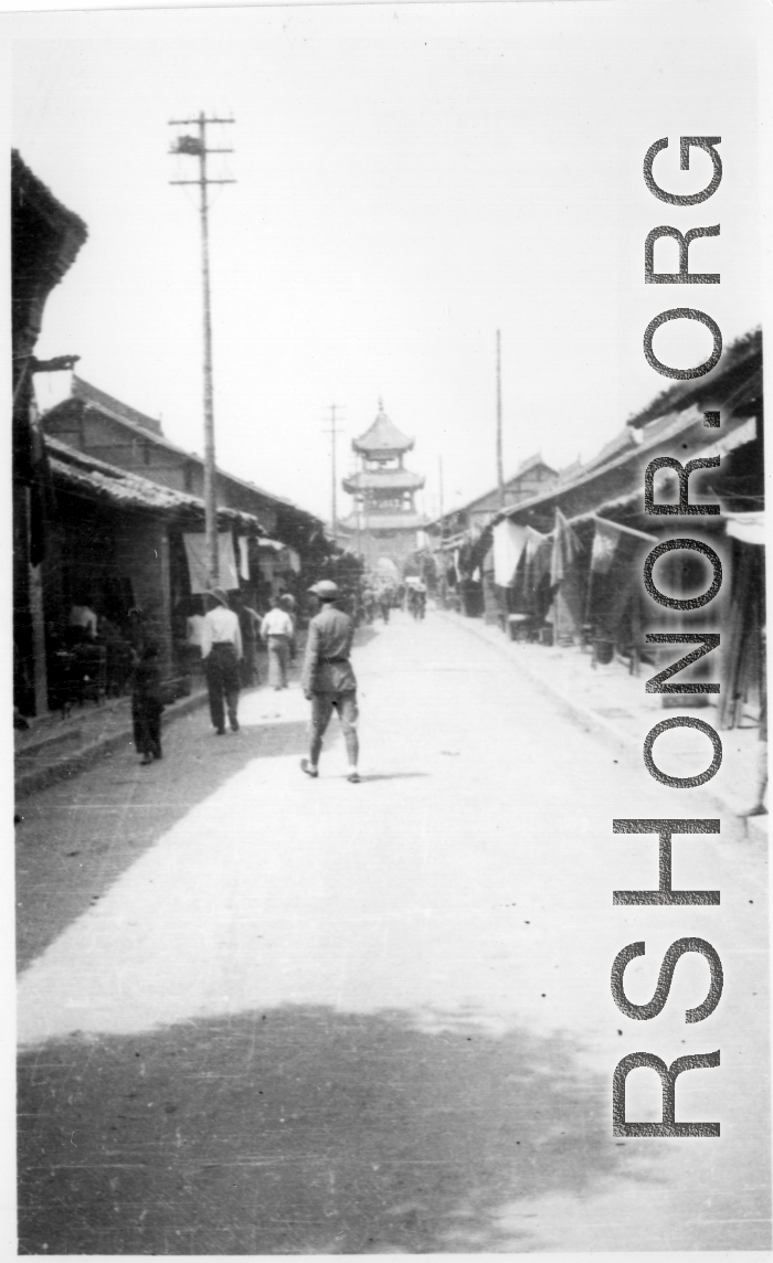 Main street leading to drum or bell tower in the city center at Hanzhong, during WWII.