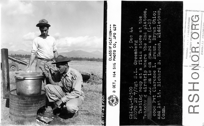 Testing soup at a field stove at the Tengchong airstrip where the 2nd Platoon, 704th AB AAA Battalion, is on guard are cook, Pvt. Clarence L. Braun, and 1st Lt. Richard B. Nason.  December 5, 1944.  Photo by T/Sgt. S. L. Greenberg. 164th Signal Photographic Company.  Passed by Emanuel Goldberg.