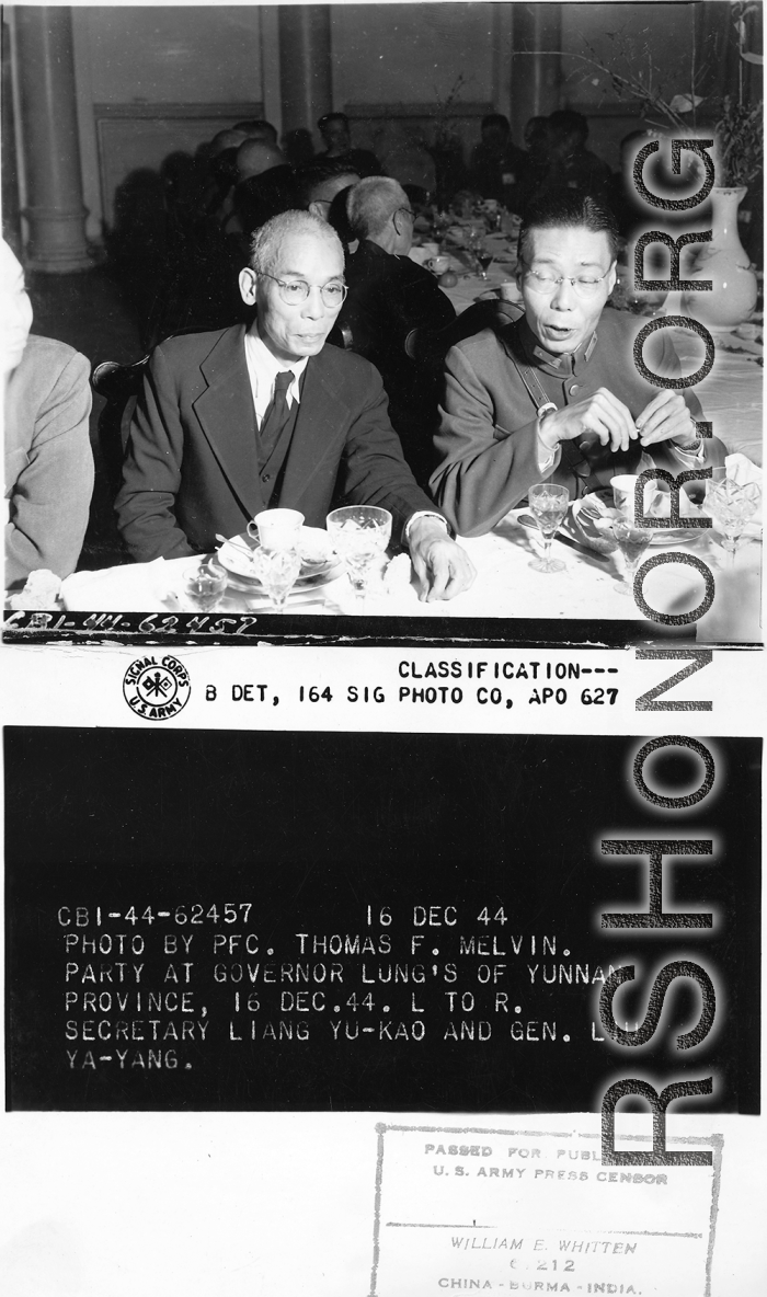 Eating banquet dinner at party at Governor Lung's of Yunnan Province on December 16, 1944. Secretary Liang Yu-kao, and Gen. Liu Ya-yang.  Photo by Pfc. Thomas F. Melvin.  Passed by censor William E. Whitten.