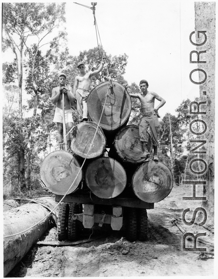 797th Engineer Forestry Company in Burma, loading logs for milling for bridge building along the Burma Road.  During WWII.