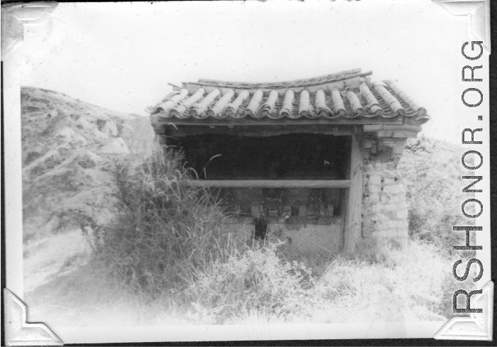 A local alter to a protective deity, apparently Guandi (关帝庙), near Kunming, China, area during WWII.