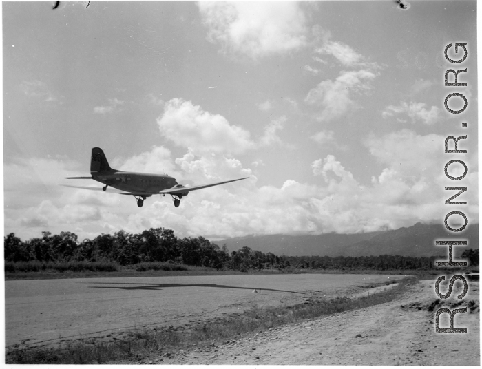 A C-47 transport taking off from an airstrip in Burma.  Aircraft in Burma near the 797th Engineer Forestry Company.  During WWII.