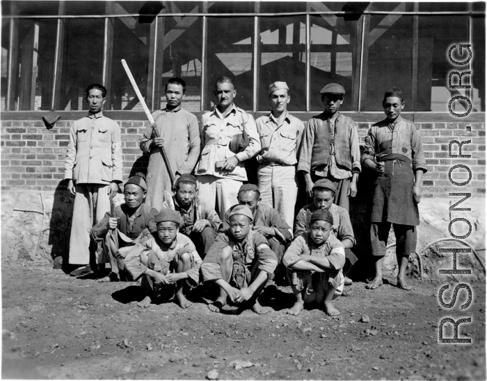 Chinese and American personnel--with sharp knives--at a beef slaughterhouse at Yangkai, set up specifically to provide meat for base personnel. During WWII.