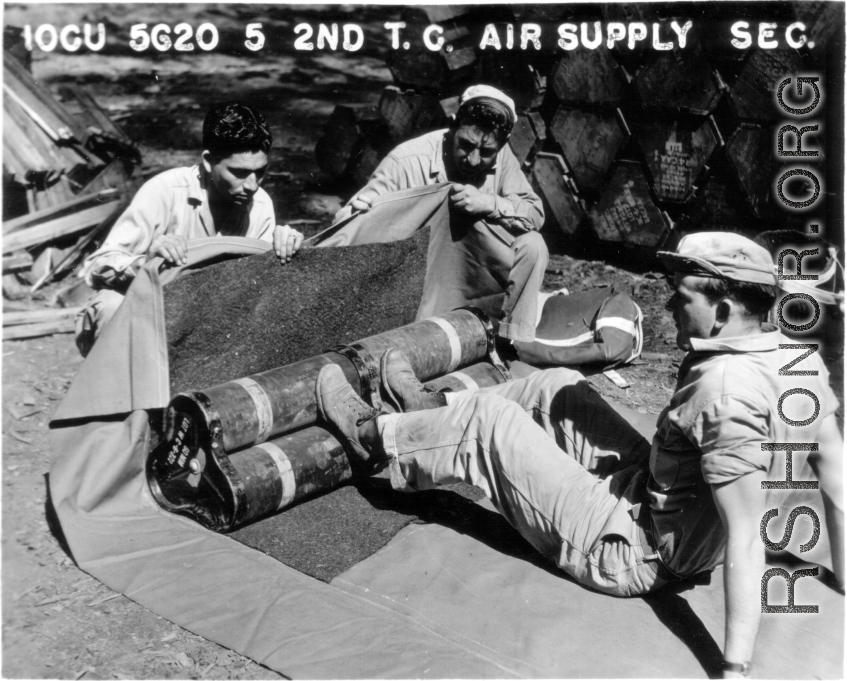 Soldiers packing for an airdrop. 10CU 5G20 5 2ND T.C. AIR SUPPLY SEC.