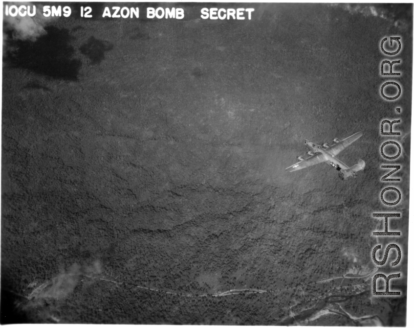IOCU 5MP 12 AZON BOMB SECRET. A B-24 bomber flying a mission.  According to this photograph's header, it may be carrying an AZON.