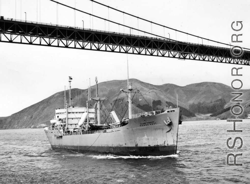 USAT Honda Knot sailing under the Golden Gate Bridge into San Francisco Bay, 10 October 1947. Honda Knot, with 3,012 World War II deceased service members for reburial in US cemeteries.	 