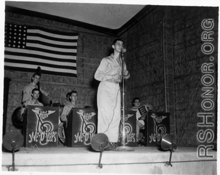 The "Jive-o-Lieps" of the 54th Air Service Group play music as a young GI works the microphone. In the CBI during WWII.