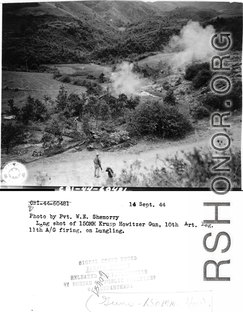 September 14, 1944  Long shot of 150MM Krupp Howitzer gun, 10th Artillery Regiment 11th A/G, firing on Lungling.  Photo by Pvt. W. E. Shemorry.  In Yunnan province, China (CBI), in WWII.
