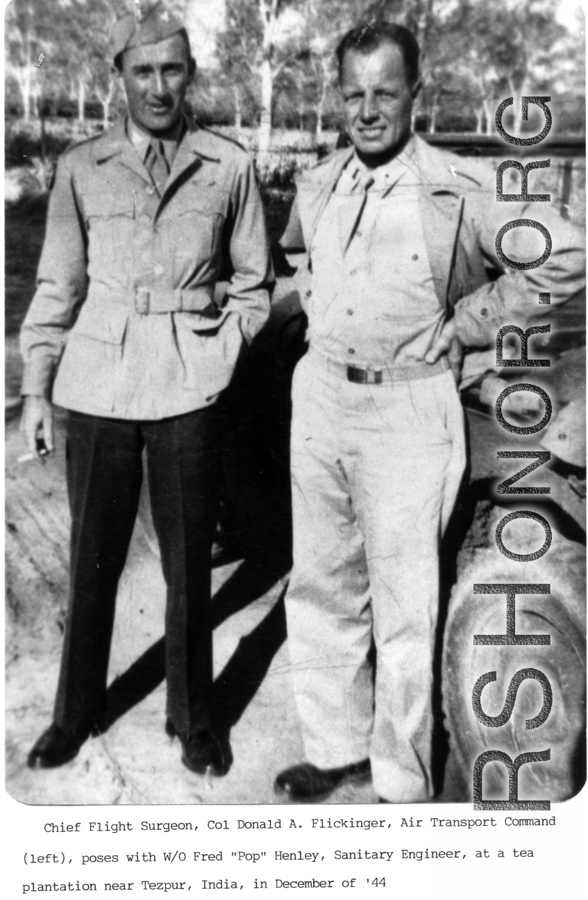 Chief Flight Surgeon, Col. Donald A. Flickinger, ATC (left), poses with W/O Fred "Pop" Henley, Sanitary Engineer, at a tea plantation near Tezpur, India, in December 1944.