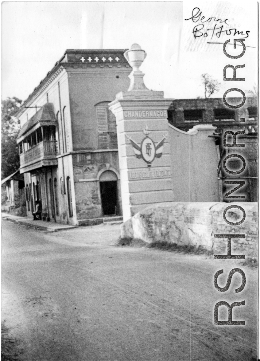 Street in Chandannagar , India, with ornate post labelled "Chandernagor."  Photo from George Bottoms.