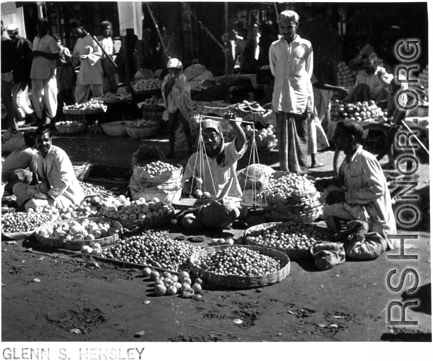 An open-air produce market in India or Burma, during WWII.  Photo from Glenn S. Hensley.