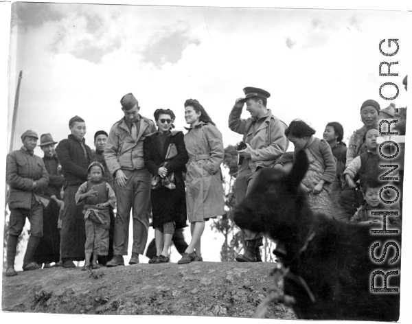 US soldiers host two charming VIP guests (one of which appears to be Dorothy Yuen Leub). In the China during WWII. 