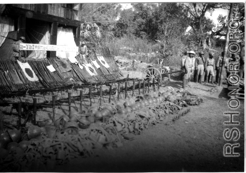 Chinese soldiers in Burma displaying captured Japanese weapons, personal gear, and  Japanese Good-Luck Flags  (寄せ書き日の丸) , during WWII. 