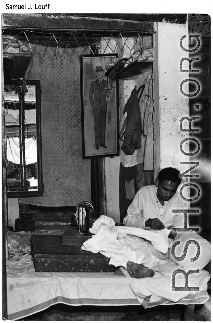 A clothing tailor working diligently in India during WWII.  Photo from Samuel J. Louff.