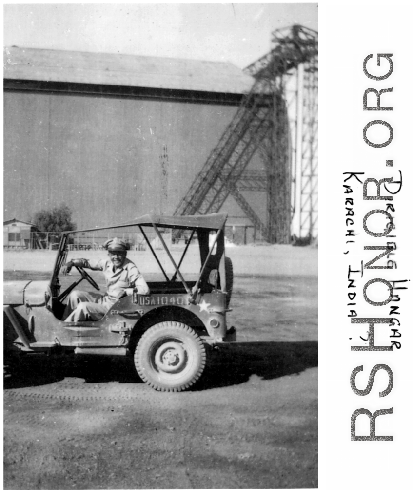 GI in front of dirigible hanger in Karachi, India, during WWII.  Image from Mark G. Mueller.  In the CBI during WWII. 