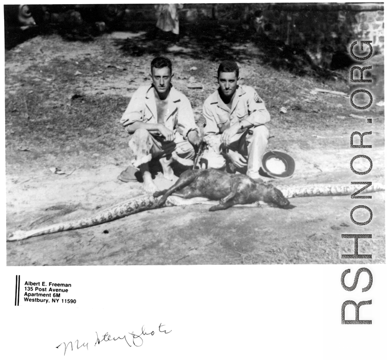 GIs in the CBI pose with a snake that ate a large mammal.  Photo from Albert E. Freeman.
