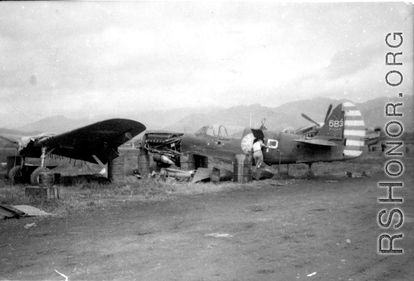 "This is a picture of one of the eight P-40's that was built from our salvage yard at Kwelin (Guilin) China. The planes had new engines installed and were tested and turned over to the fighter groups for combat service.To our knowledge all planes performed to everyone's satisfaction." Caption courtesy of Elmer Bukey.