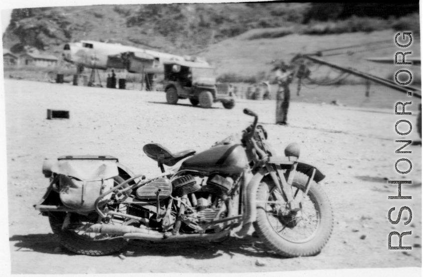 "Lt.Sohl took this cycle with him to every base we serviced. I had never ridden a cycle before and he let me ride it around the revetment one day and I ended up driving right thru the door of the engineering shack and pinned "Rocky" Taurisano against the back wall of the shack. That was the first and last time I ever rode a cycle." Caption courtesy of Elmer Bukey.