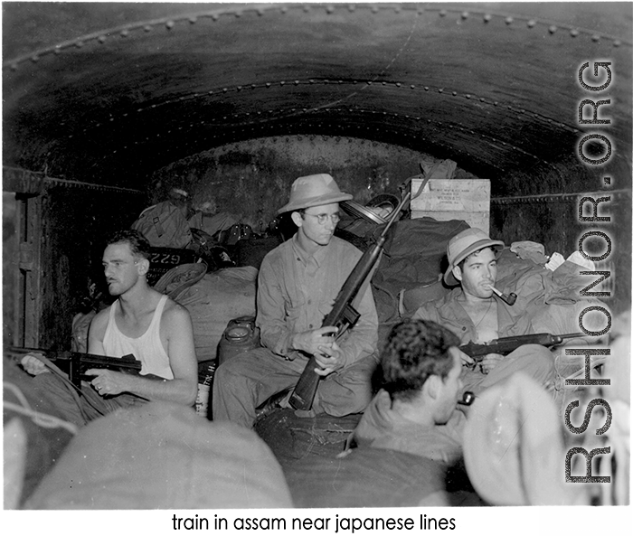 Armed Americans on a train in Assam near Japanese lines. During WWII.