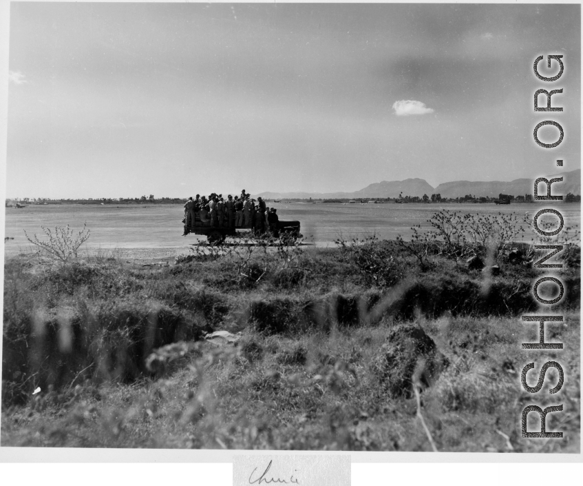 A truck with crews and mechanics zipping around Kunming base, during WWII.