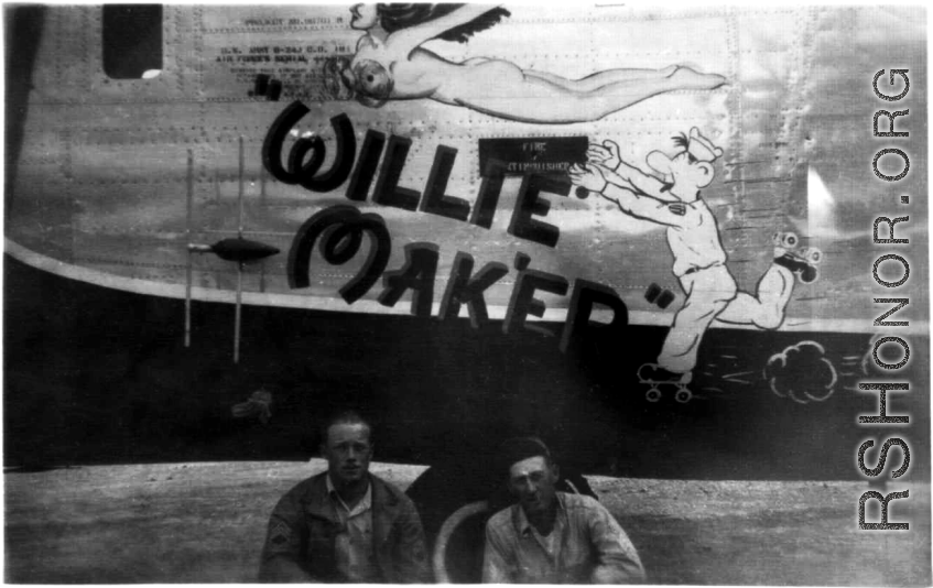 Two US servicemen pose in front of the B-24 "Willie Mak'er".  From the collection of Robert H. Zolbe.