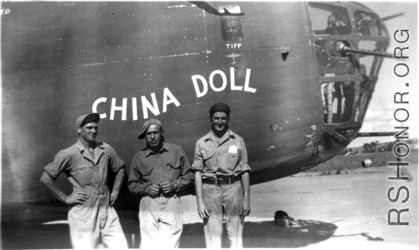 Four US servicemen in front of the B-24 "China Doll".  Note the fourth face in the small port above, labeled "Tiff".   From the collection of Robert H. Zolbe.