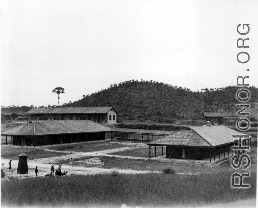 A set of buildings and covered walkway at an American base in China during WWII.