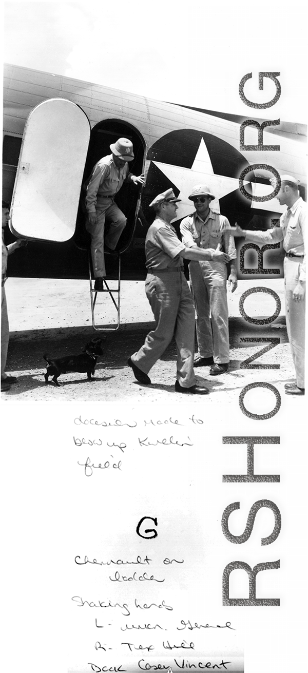 Air Force leadership in China meet to decide to blow up the US air base at Guilin in the face of the Japanese advance during Ichigo in the summer/fall 1944. General Chennault, in pith helmet, is climbing down from the C-47 transport airplane, and an unknown general is reaching out in the middle, with Casey Vincent behind, and Tex Hill, always a all man, reaches to shake hands from the right.