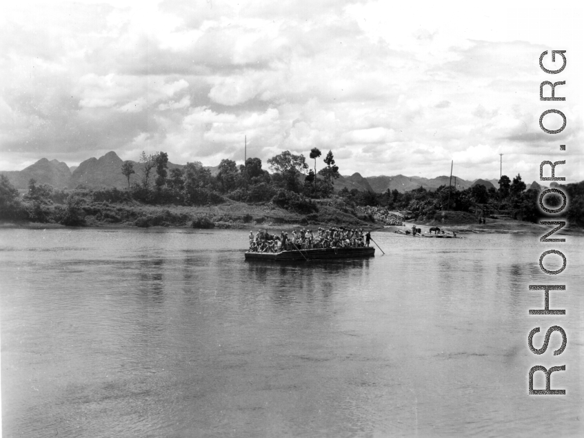 Retreating by ferry near Lingling in the face of the Japanese advance in the fall of 1944, crossing a river by ferry.