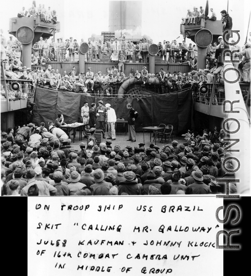 "On troop ship USS Brazil. Skit 'Calling Mr. Galloway.' Jules Kaufman & Johnny Klock of the 16th CCU in the middle of the group."  GIs on the way back home in the US after the war. The viewers include dozens of African-American GIs mixed in, before the stage.