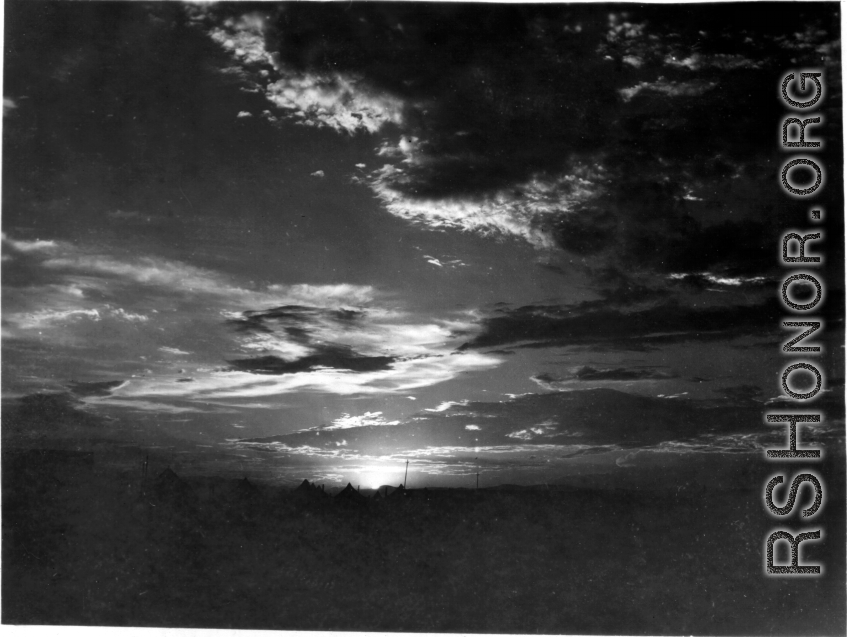 Tents for GIs at the American base at Liuzhou during WWII, silhouetted against the sunset.