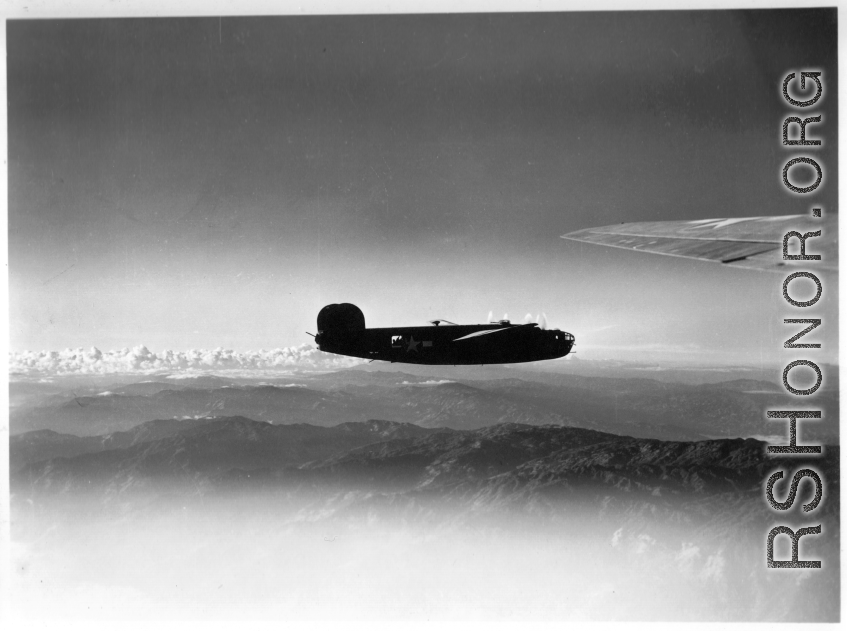 B-24 in the CBI during WWII,  flying over mountains in the southwest China region.