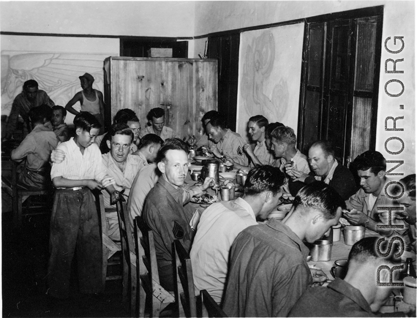 GIs eating nice meal in club house or nice mess hall in Yunnan, China, during WWII.